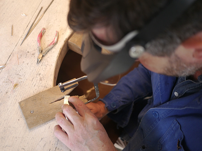 Overhead shot of Alex creating a jewelry piece