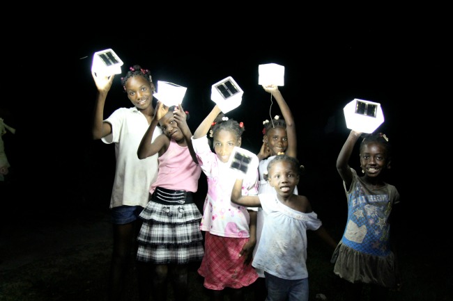 Children at an orphanage in Haiti using SolarPuffs 